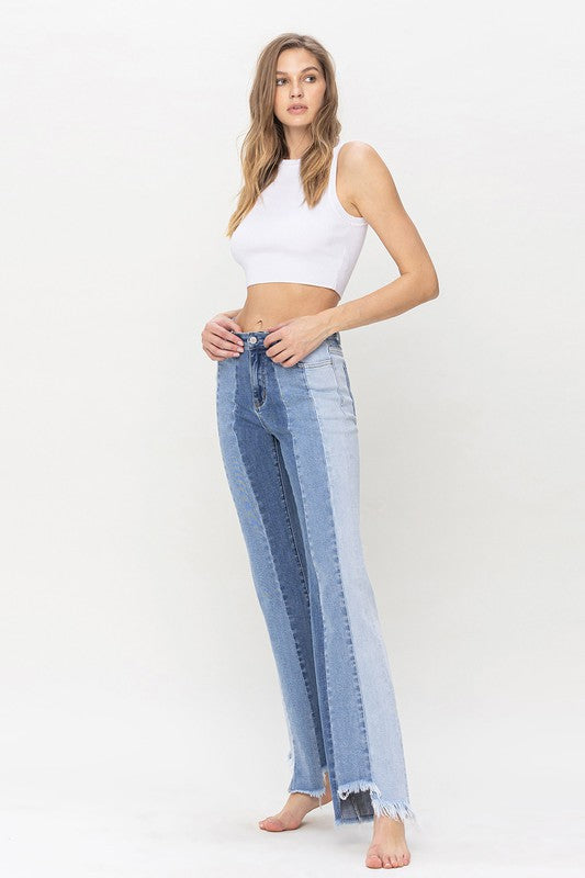 High Rise Relaxed Flare Jeans With Uneven Raw Hem from Vervet