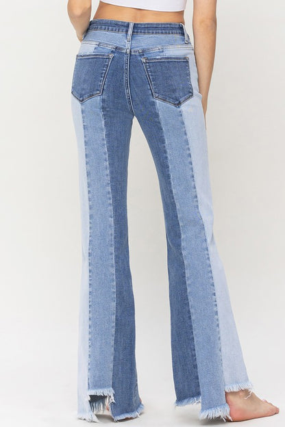 High Rise Relaxed Flare Jeans With Uneven Raw Hem from Vervet