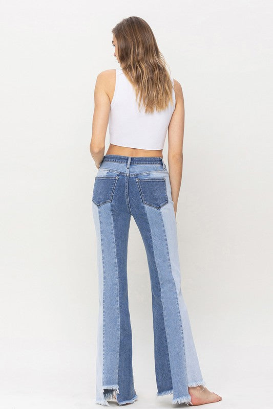 High Rise Relaxed Flare Jeans With Uneven Raw Hem from Vervet