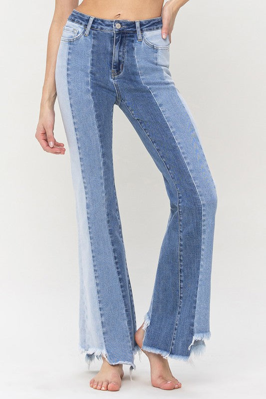 High Rise Relaxed Flare Jeans With Uneven Raw Hem from Vervet