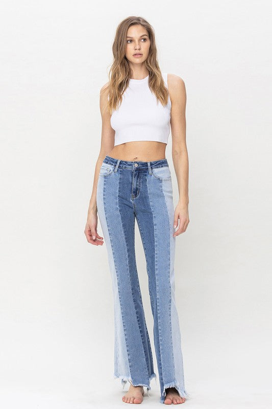 High Rise Relaxed Flare Jeans With Uneven Raw Hem from Vervet